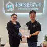 Staff receiving certificate of achievement at Concept Care